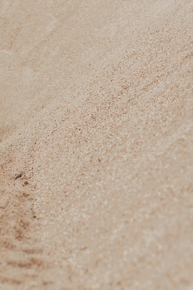 Tan textured surface with subtle variations.