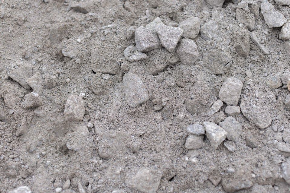 Pile of gray sand and small gravel.