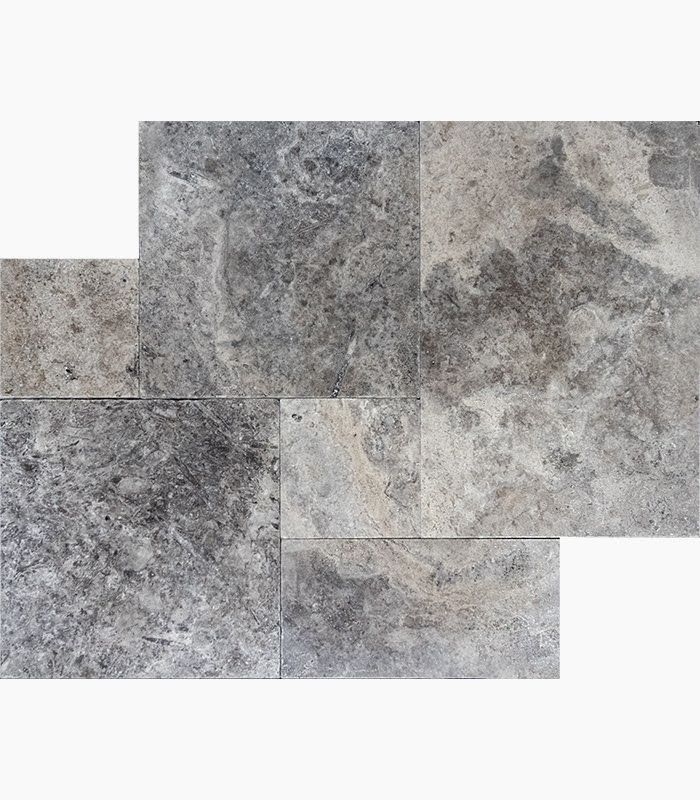 Gray and beige travertine tile arranged in a rectangular pattern.