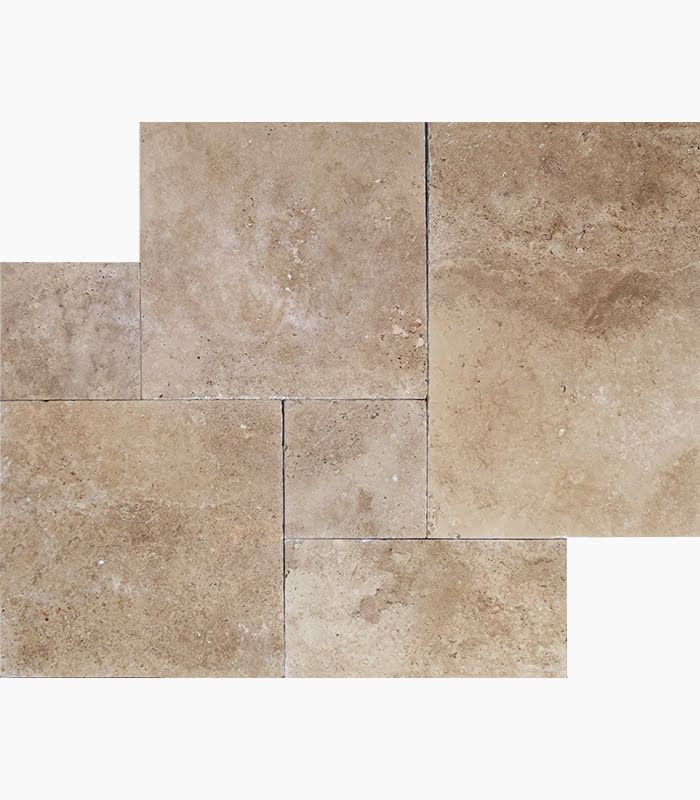 Beige travertine tile arranged in a rectangular pattern, showing variations in tone and texture.