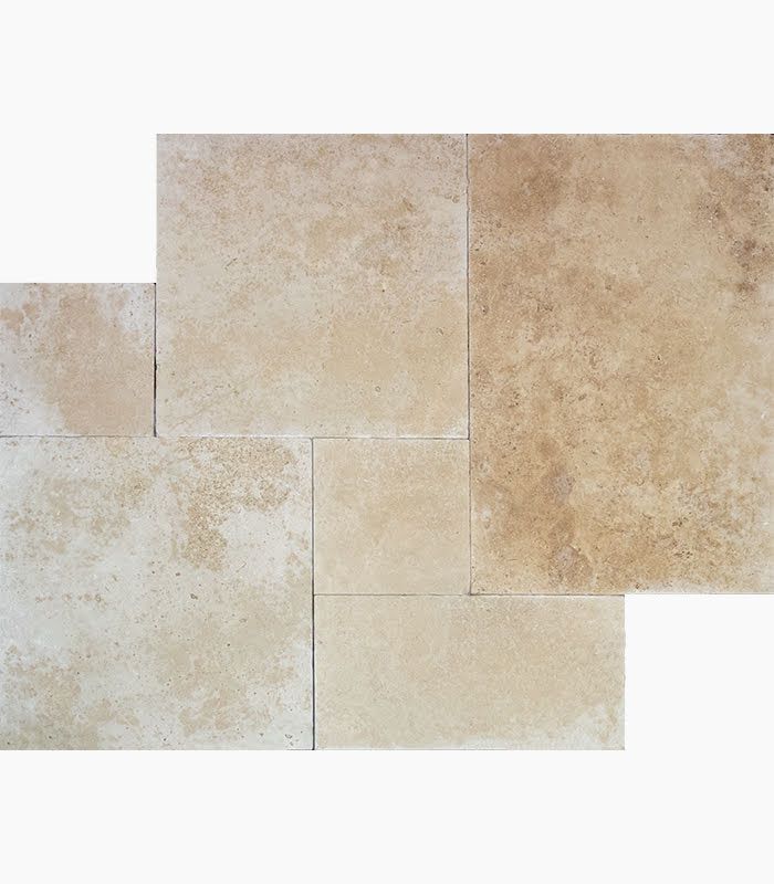 Beige and tan stone tiles arranged in a random pattern, showing variations in color and texture.