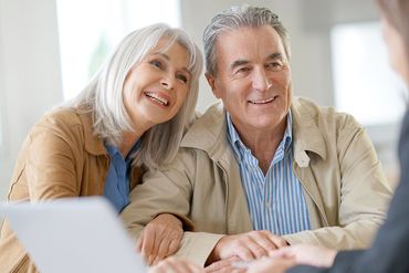 Two elderly couple discussing about estate planning