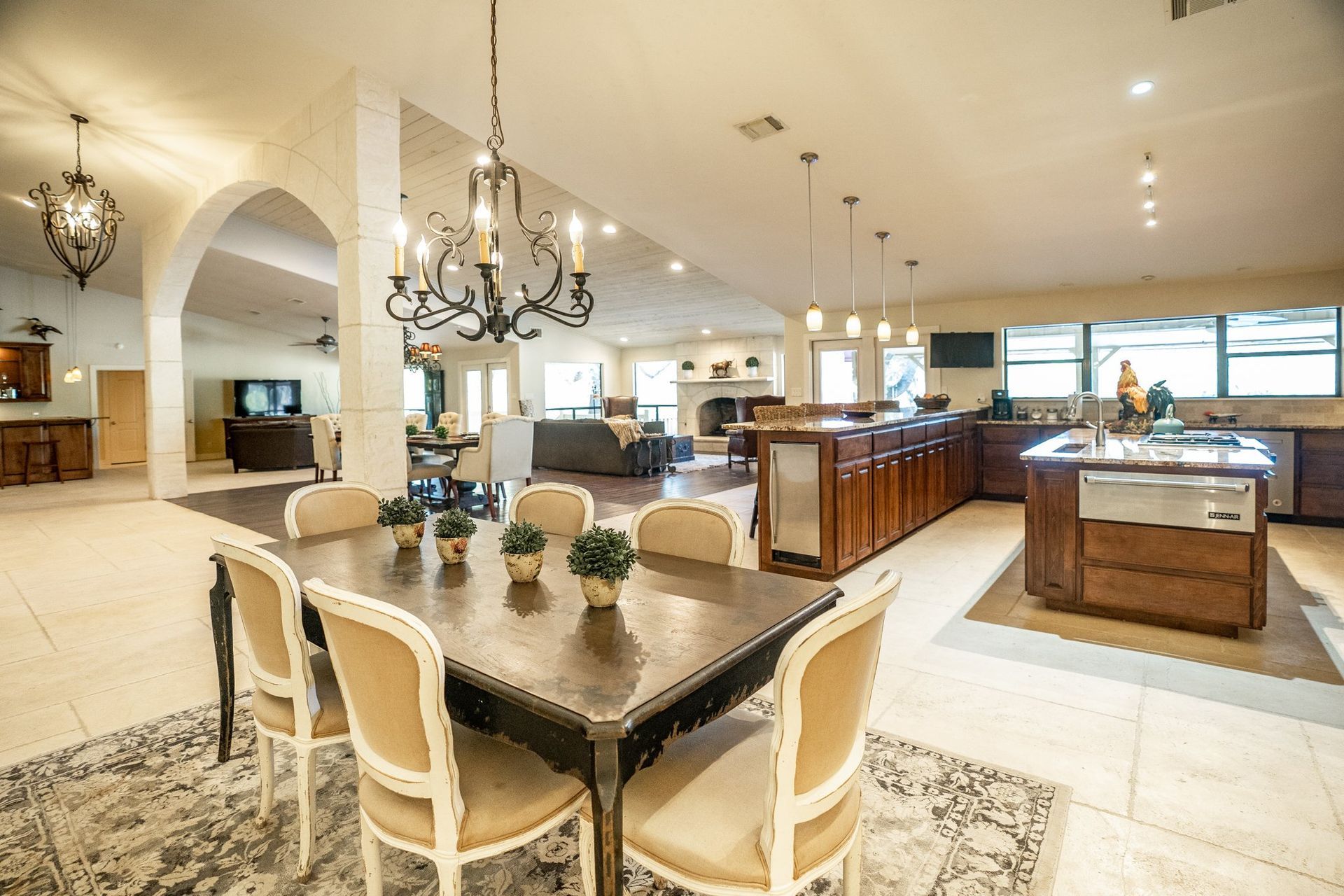 A large room with a dining table and chairs in it