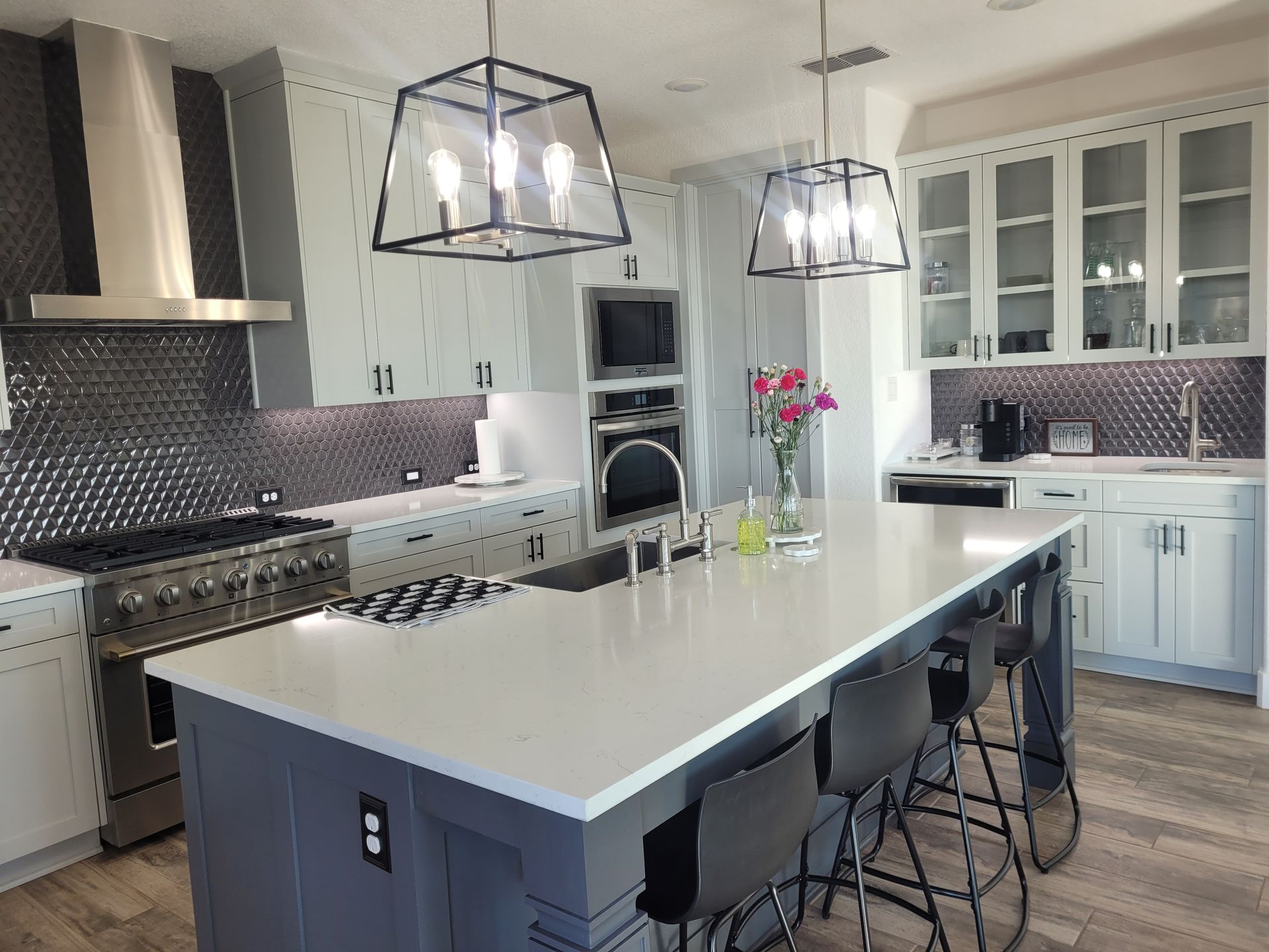 Kitchen with dark brown cabinets, a tiled backsplash, and light gray walls.