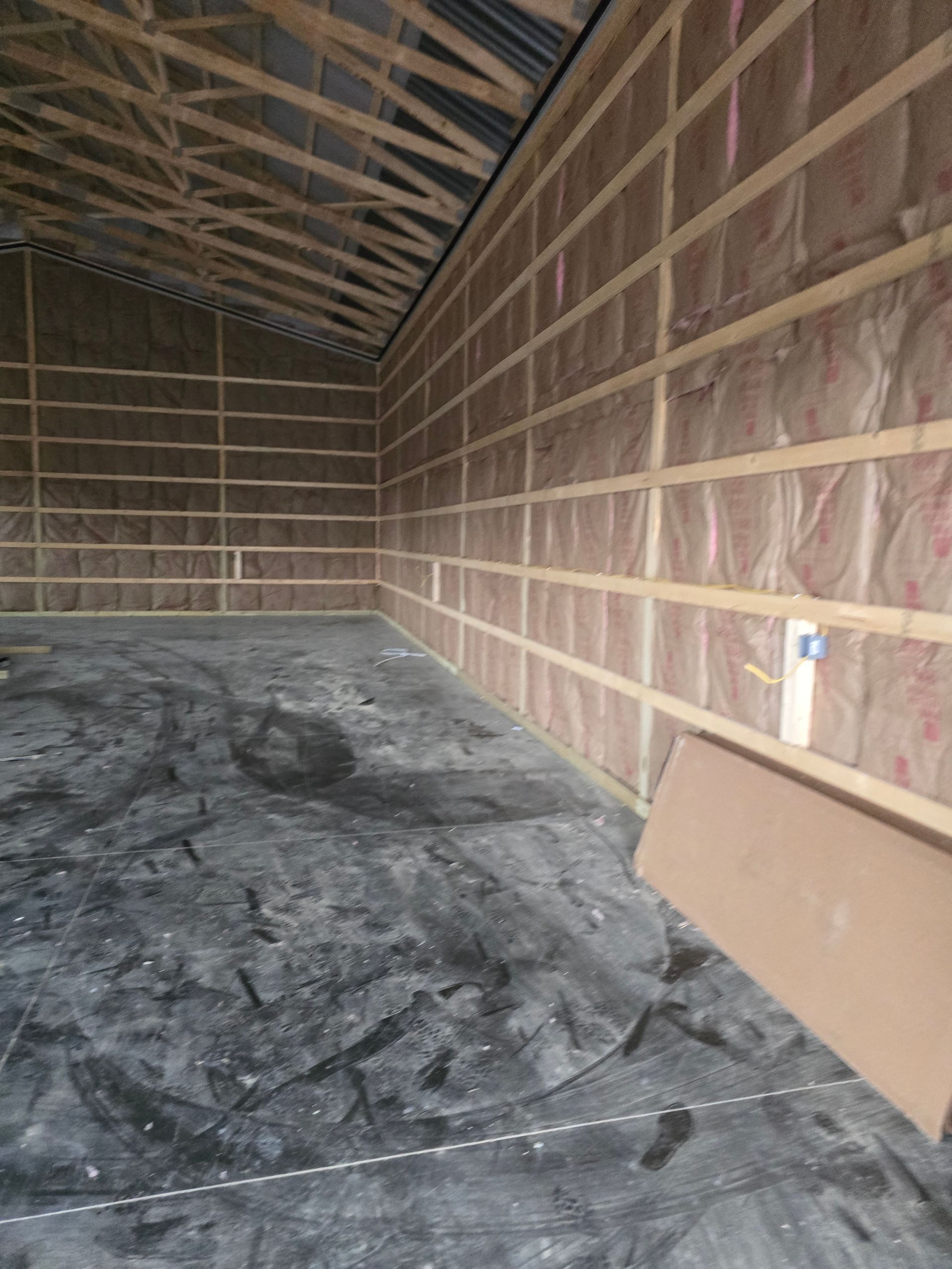 The inside of a building with a lot of insulation on the walls.