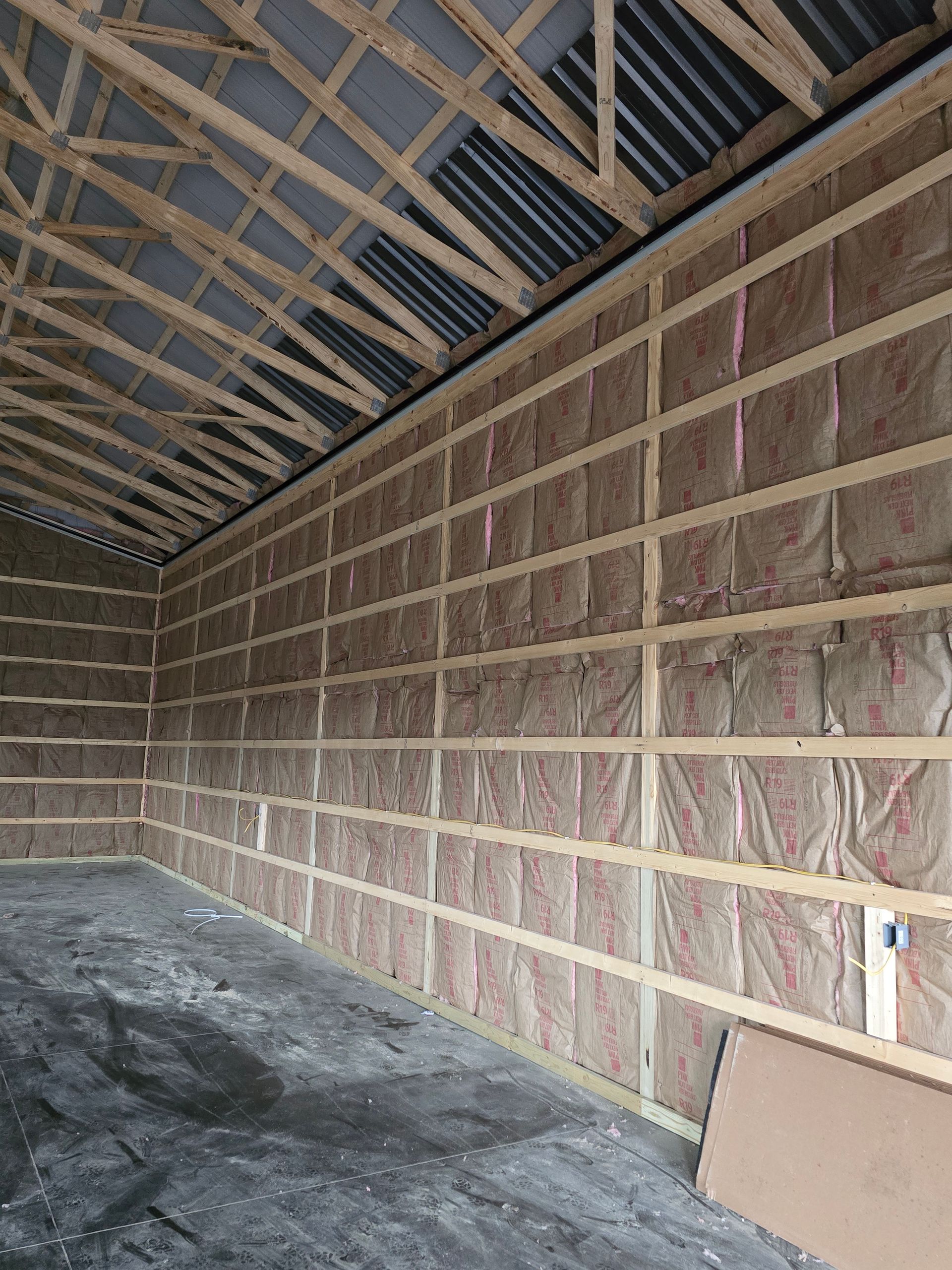 The inside of a building with a lot of insulation on the walls.