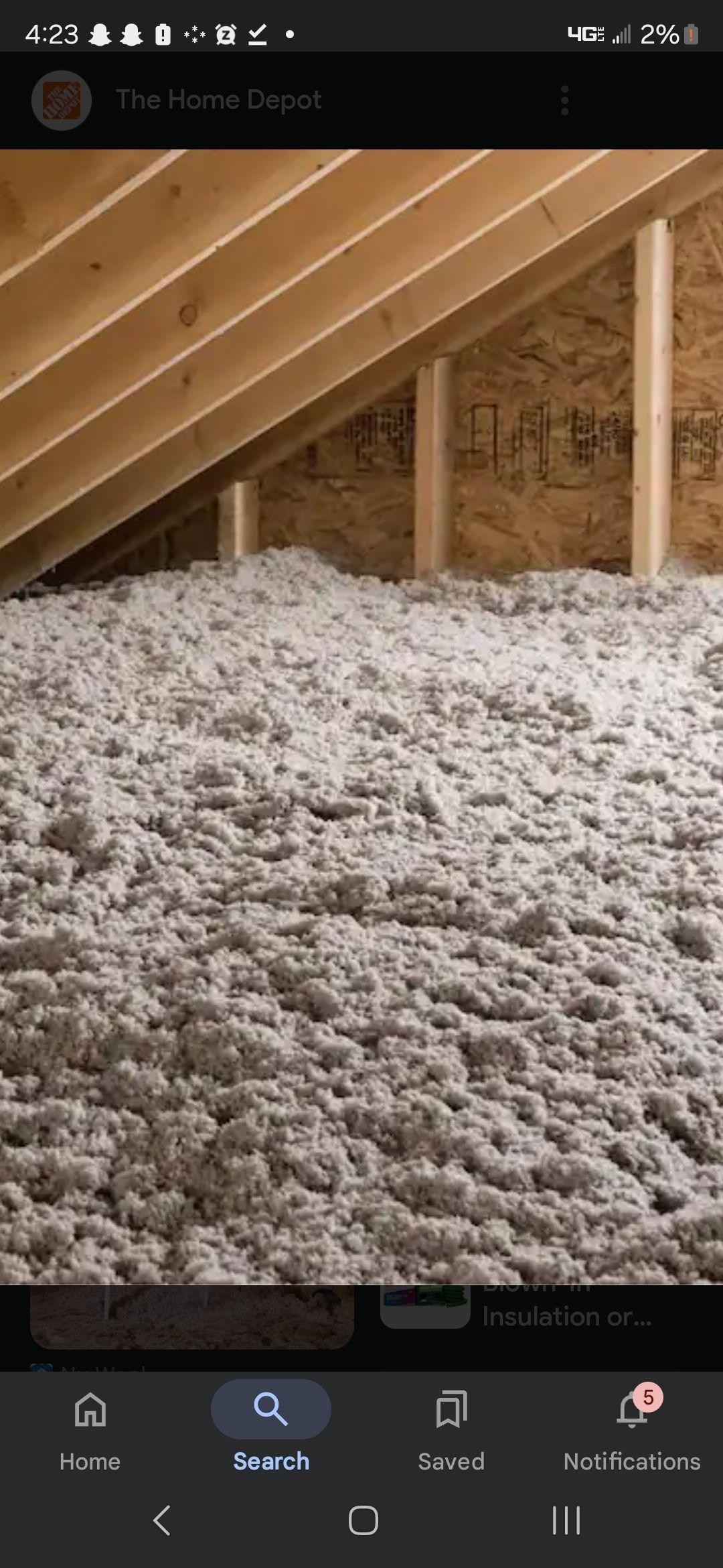 There is a lot of insulation in the attic of a house.