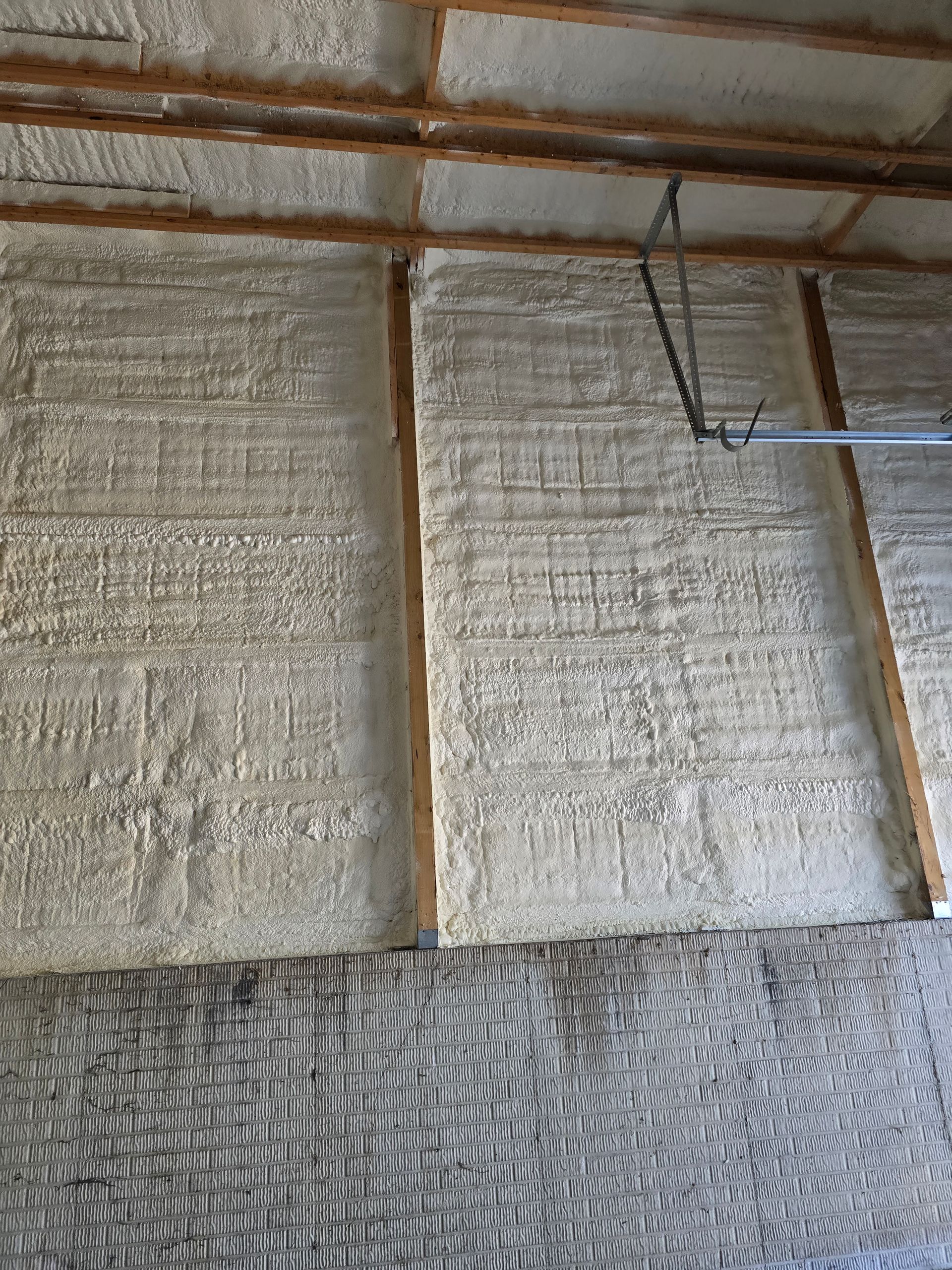 A garage with a lot of foam on the walls and ceiling.