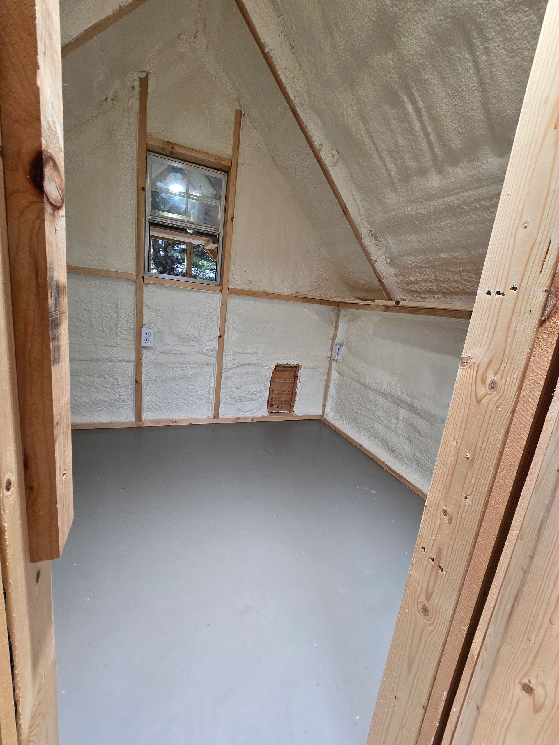 There is a window in the corner of the room.