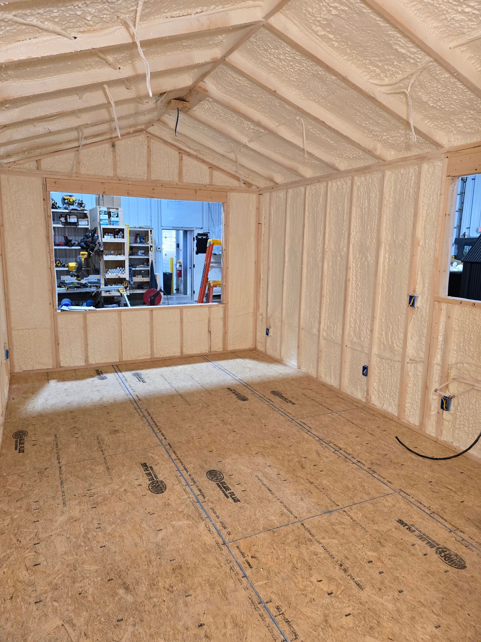 A room with a lot of foam on the walls and a window.