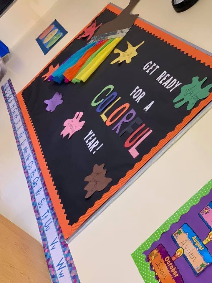Classroom bulletin board with “Get Ready for a Colorful Year!” and bright paper stars.