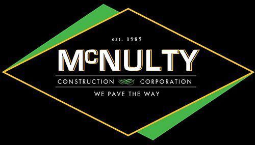 A logo for a construction company called mcnulty construction corporation.