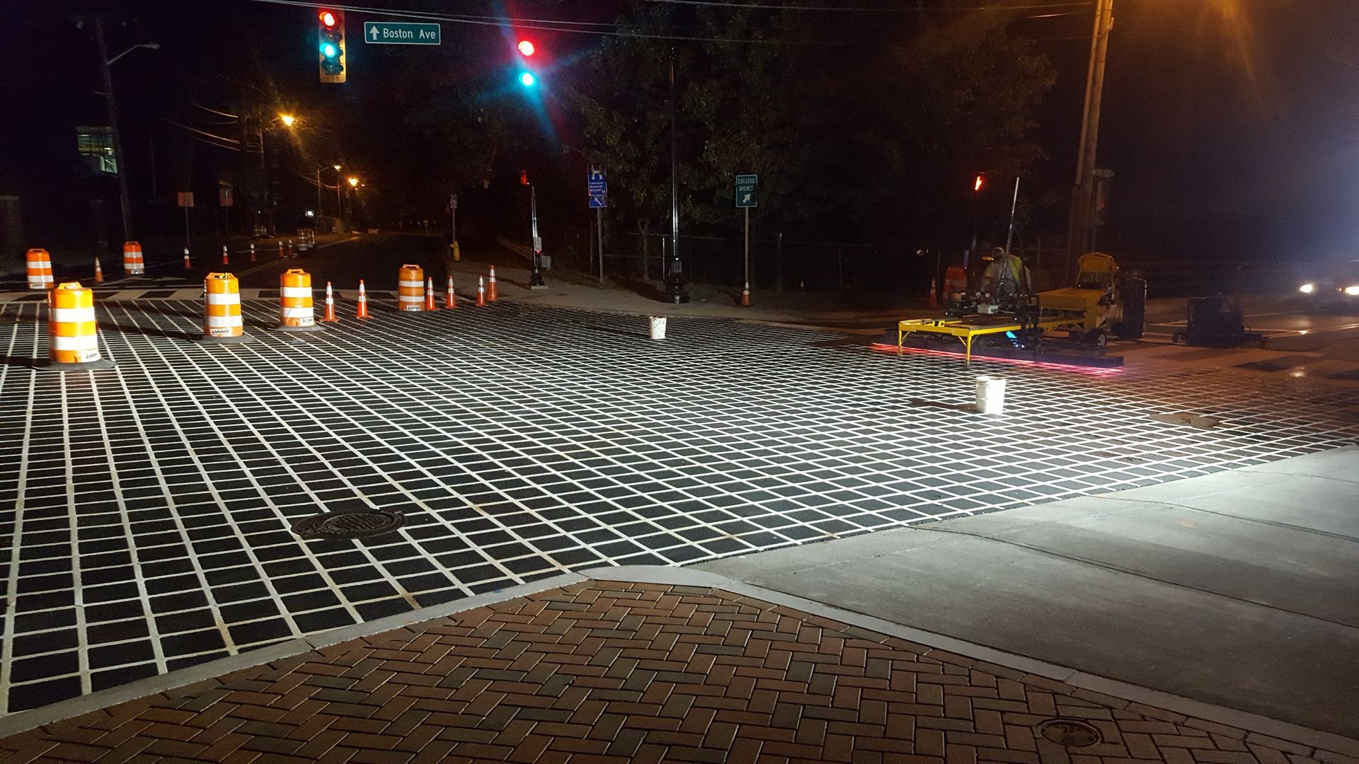 A street with a lot of bricks on it at night