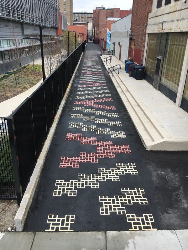 A walkway with a maze pattern on it