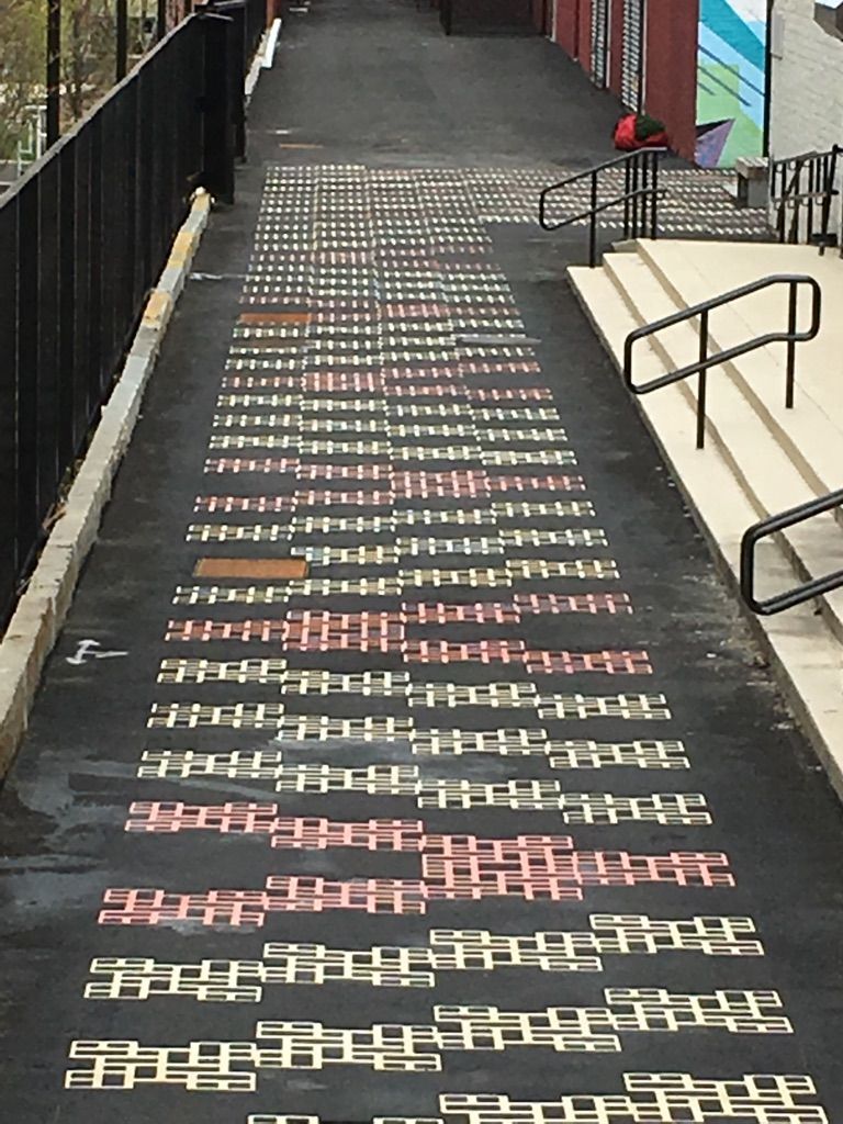 A chalk drawing on the side of a road