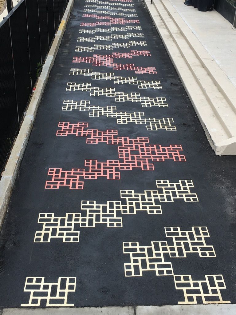 A row of letters on a black surface that says ' a ' on it