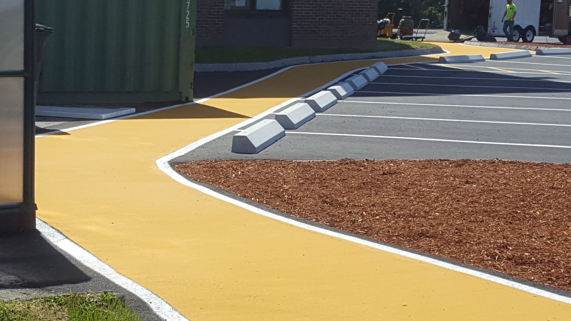 A yellow and white road with a white line on it