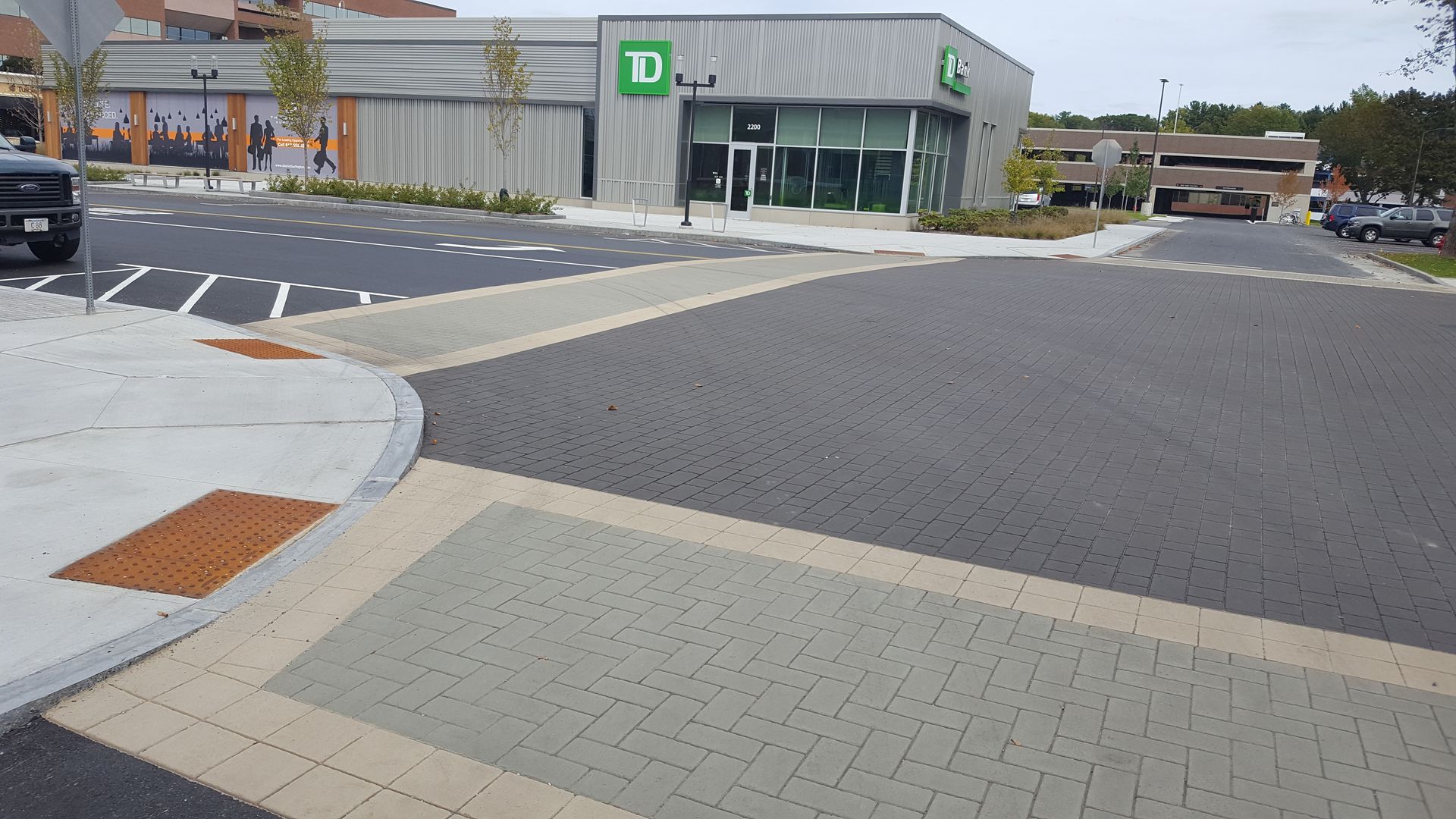 A parking lot with a td bank in the background