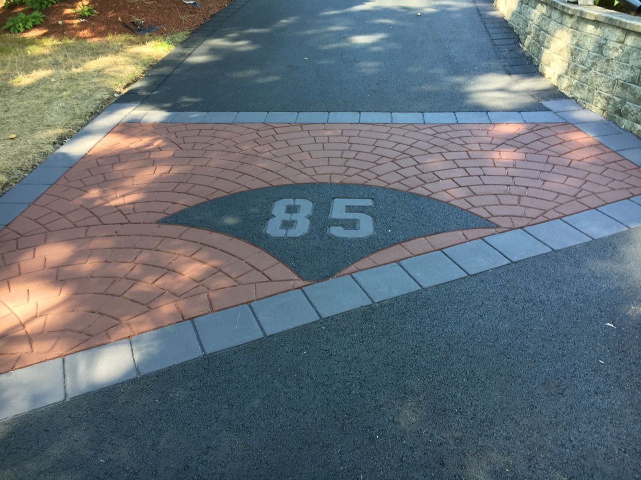 A driveway with the number 85 painted on it
