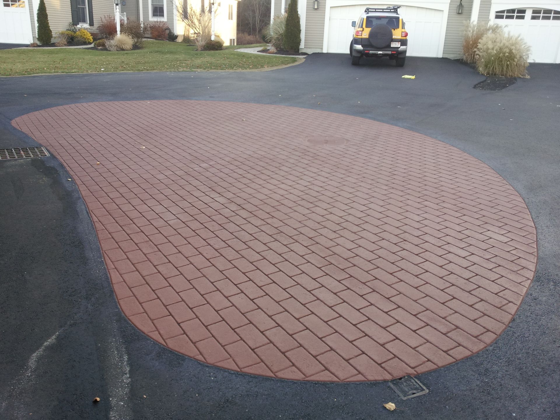 A jeep is parked in the driveway of a house