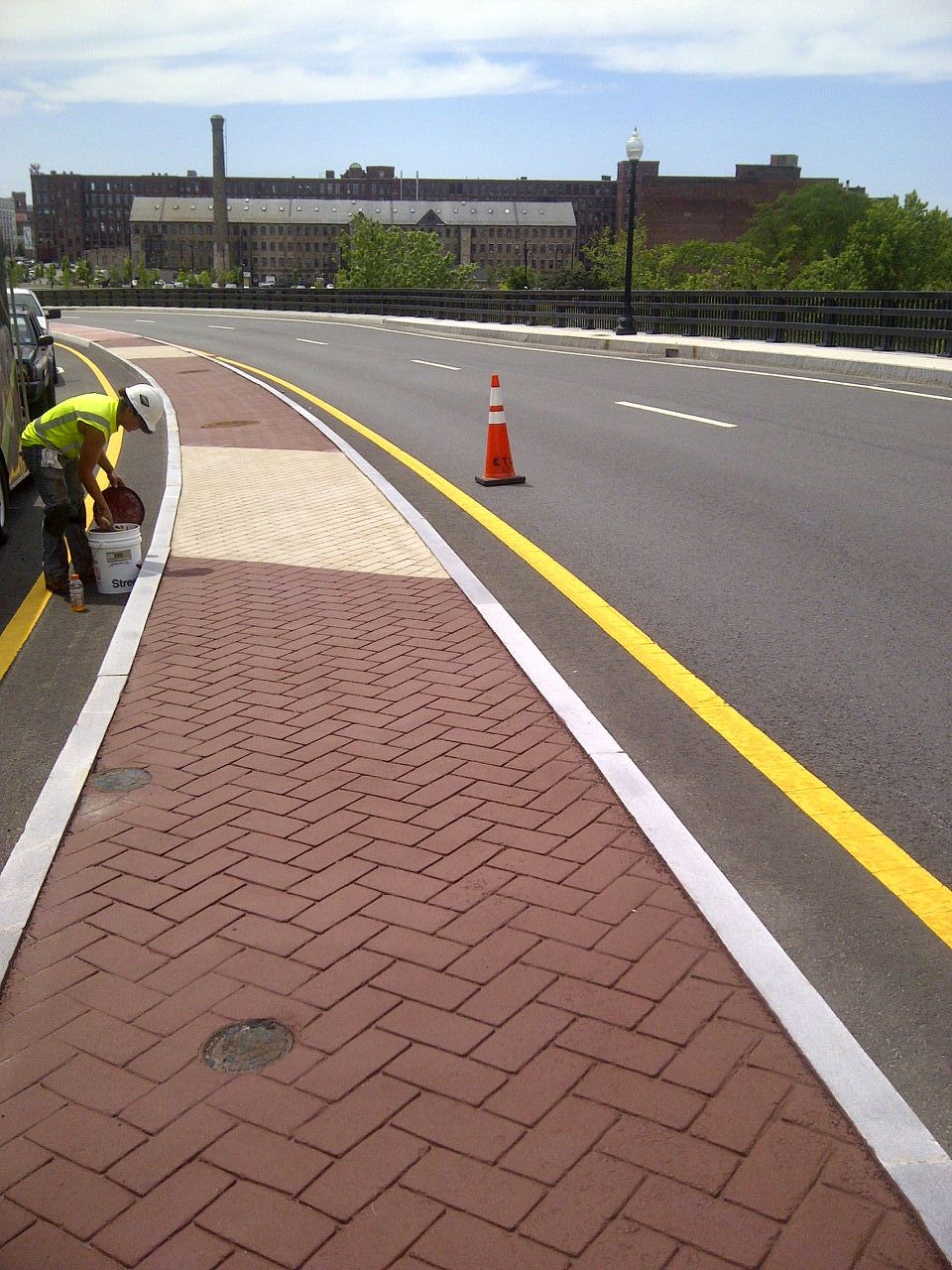 A yellow line is painted on the side of a road