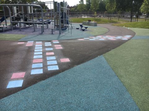 A playground with chalk drawings on the ground
