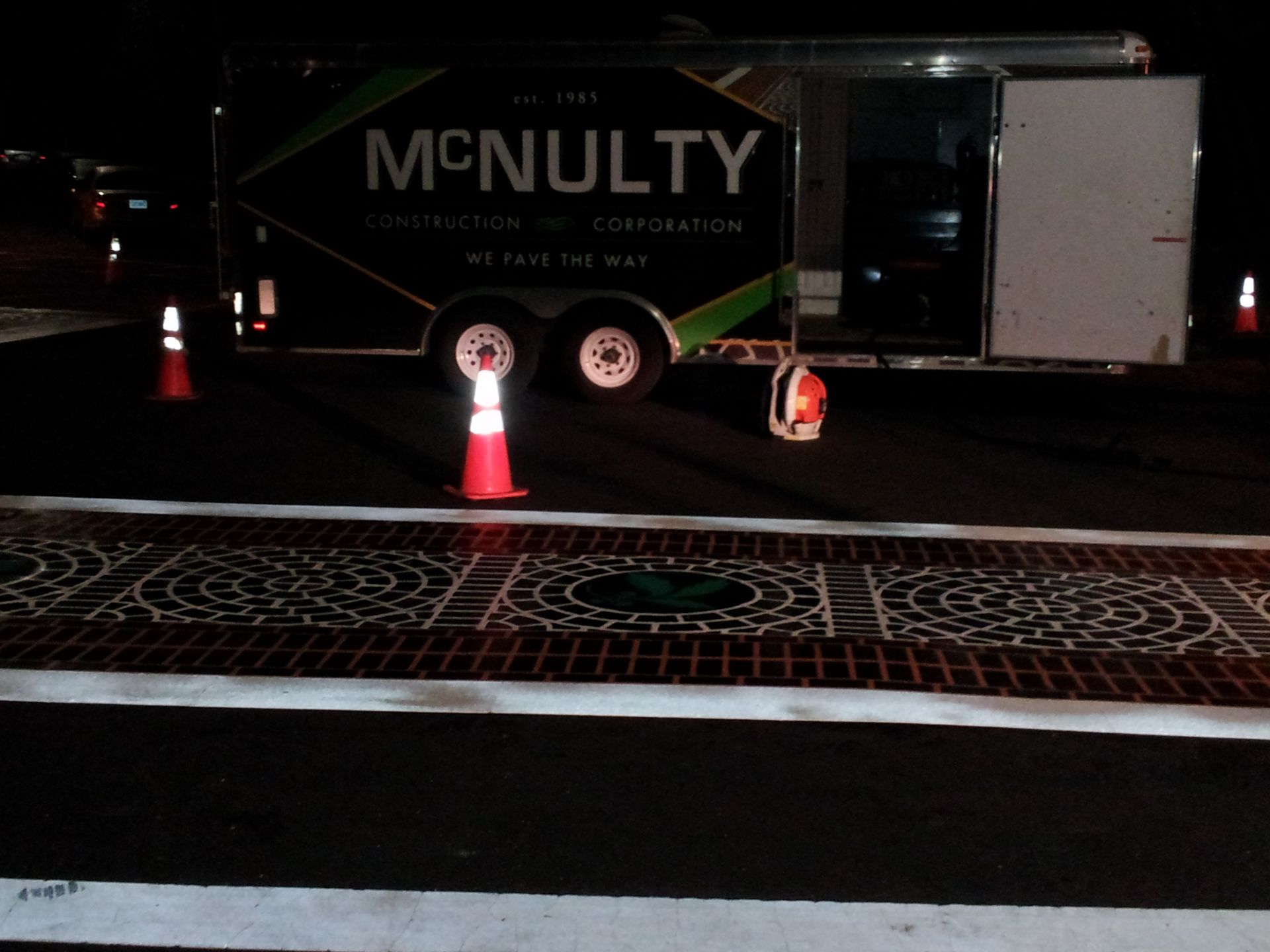 A mcnulty trailer is parked on the side of the road