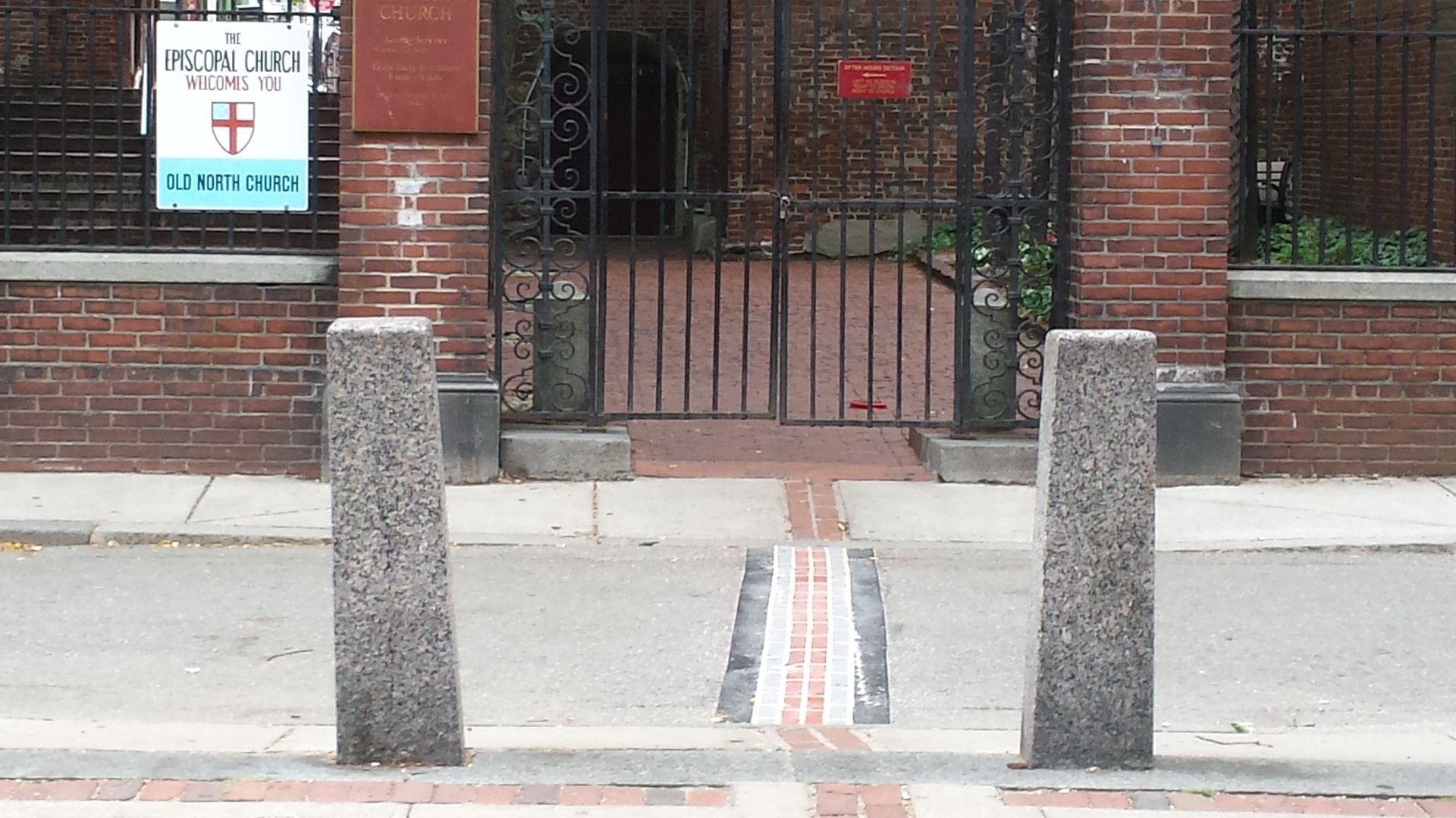 A brick building with a sign that says ' ambulance ' on it