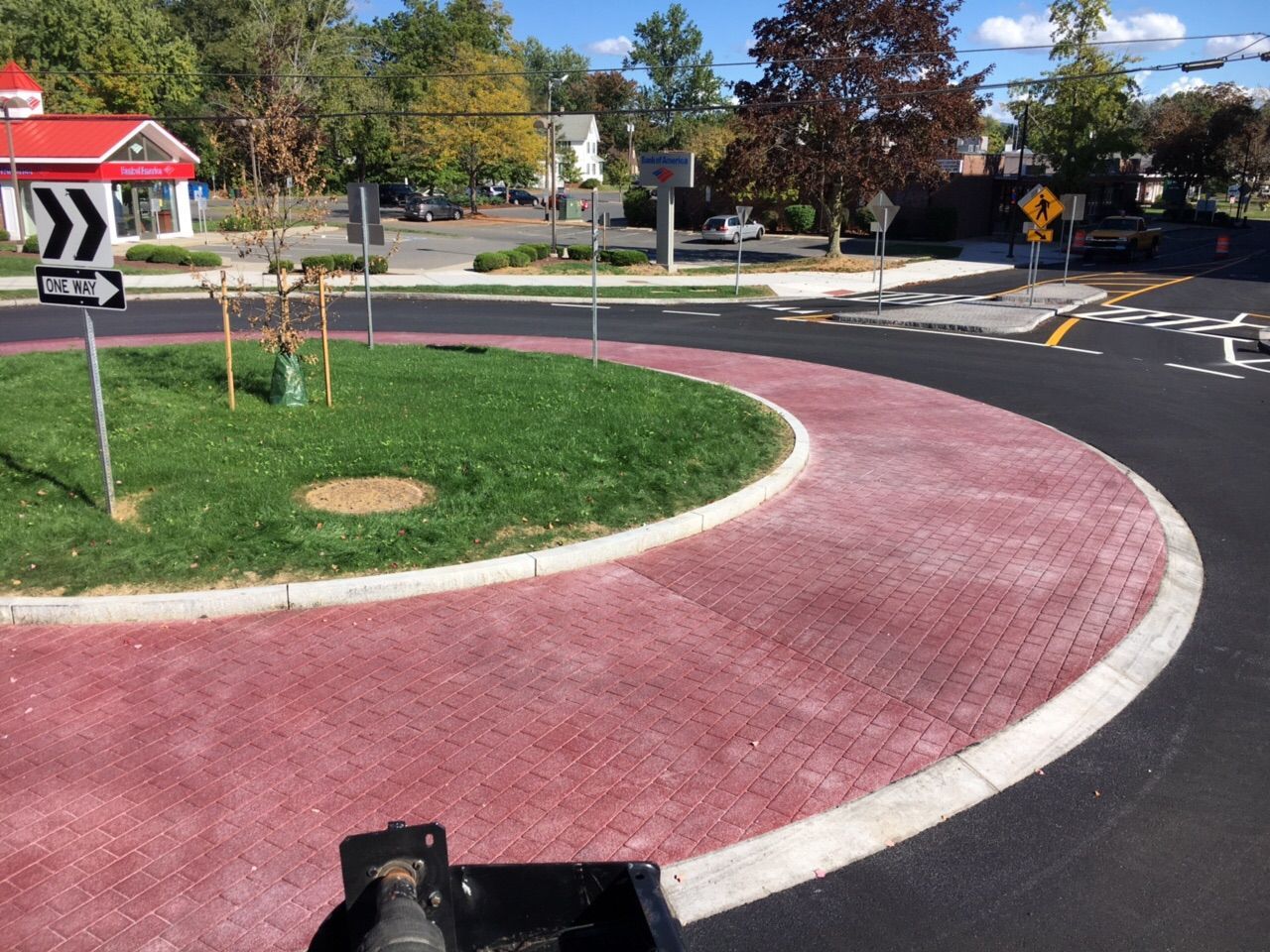 A roundabout with an arrow pointing to the right