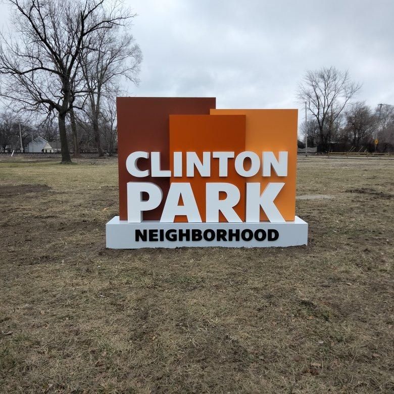 A sign that says clinton park neighborhood