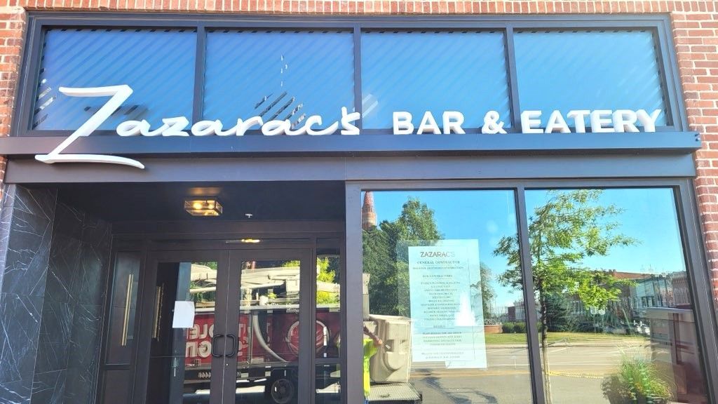 Zazarac's Bar & Eatery storefront with glass windows and a sign; exterior view.