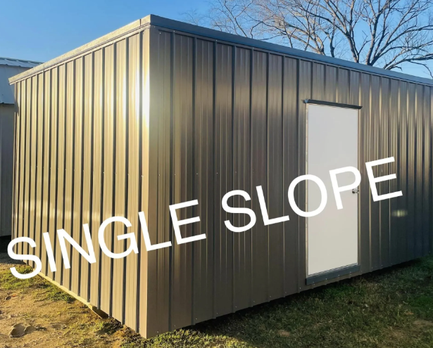 Brown metal single-slope shed with white door under a clear blue sky