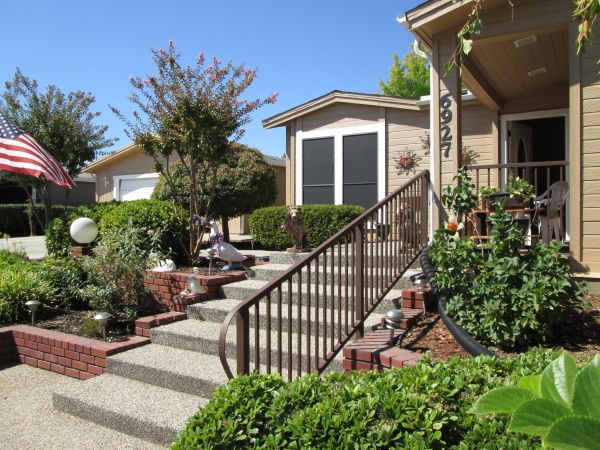 A house with stairs leading up to the front door