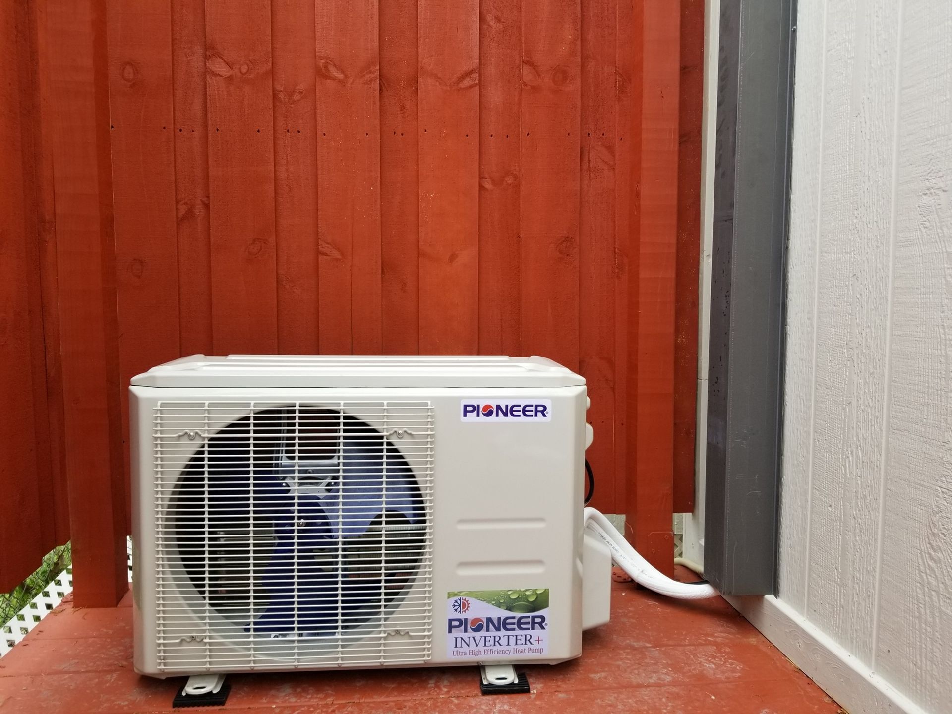 A pioneer brand air conditioner is mounted to a wall