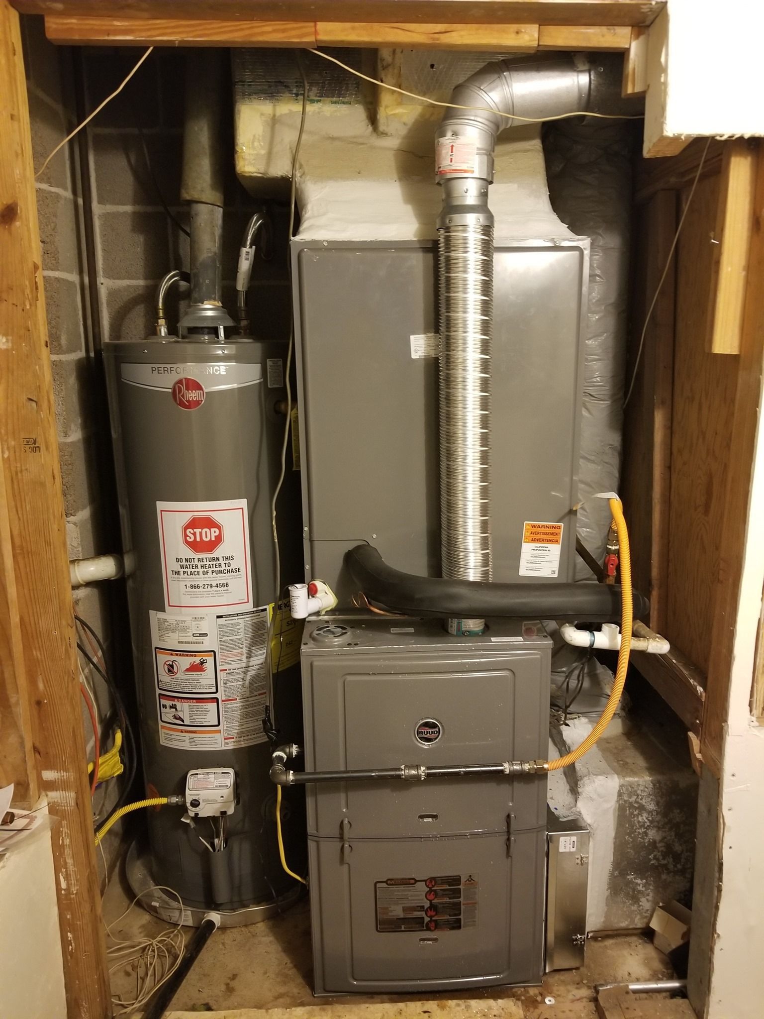 There is a water heater and a furnace in the basement.