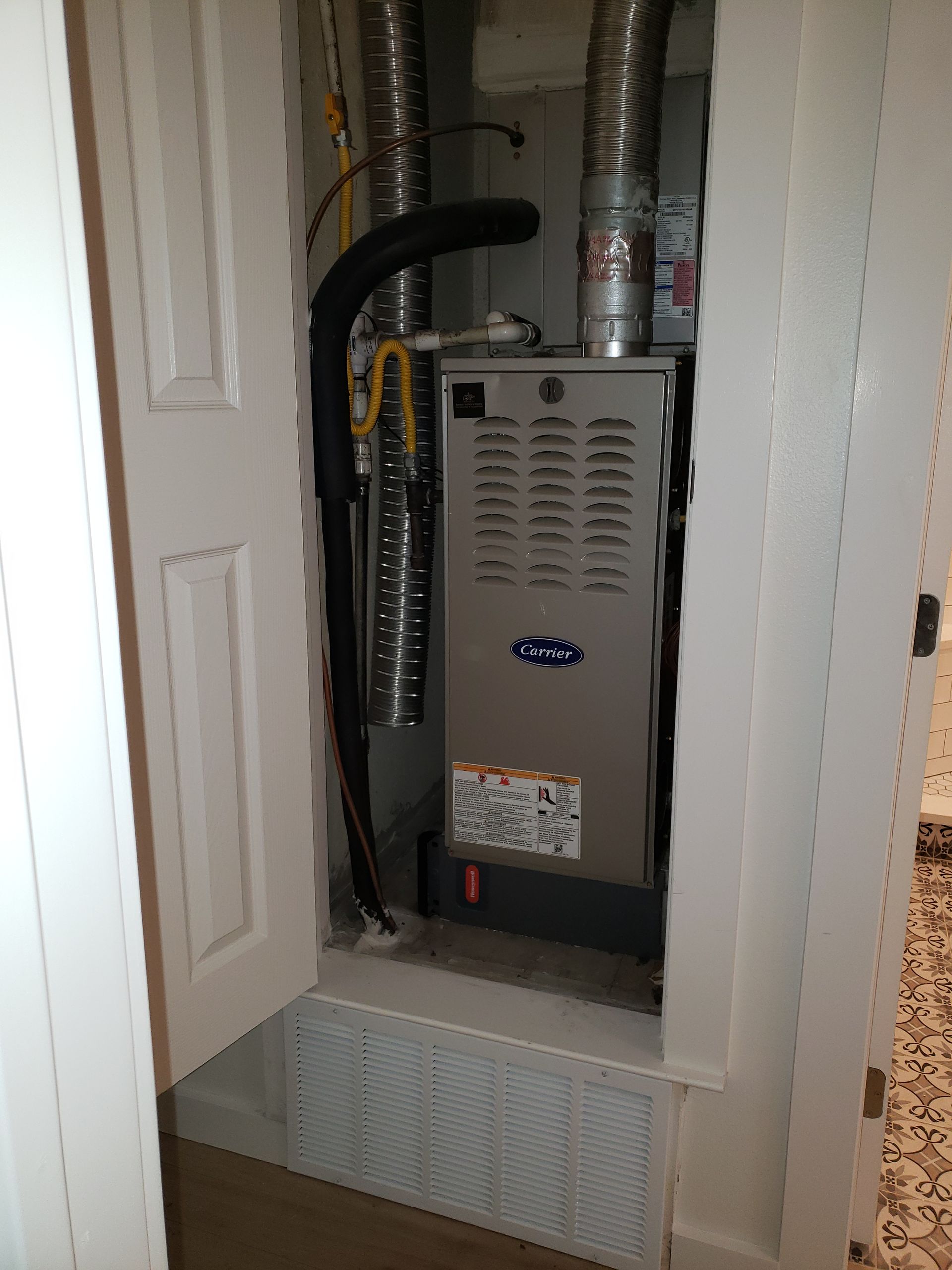 An air conditioner is installed in a closet in a house