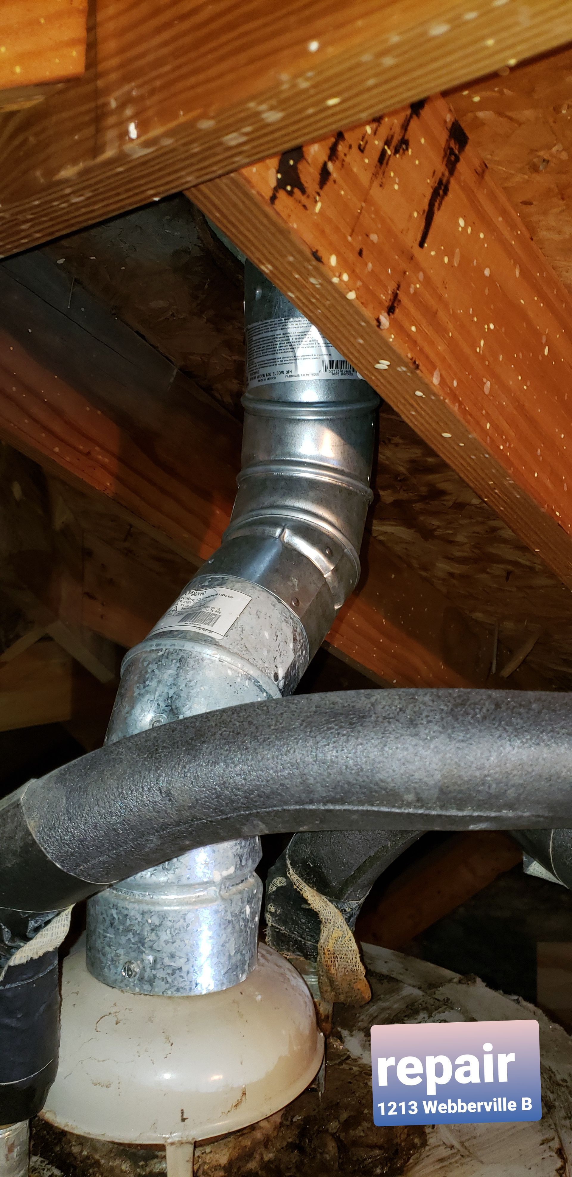 A metal pipe is hanging from the ceiling of a house