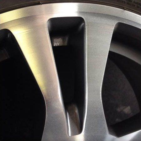 A close up of a car wheel with a tire on it