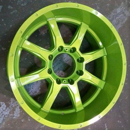 A close up of a green wheel on a table