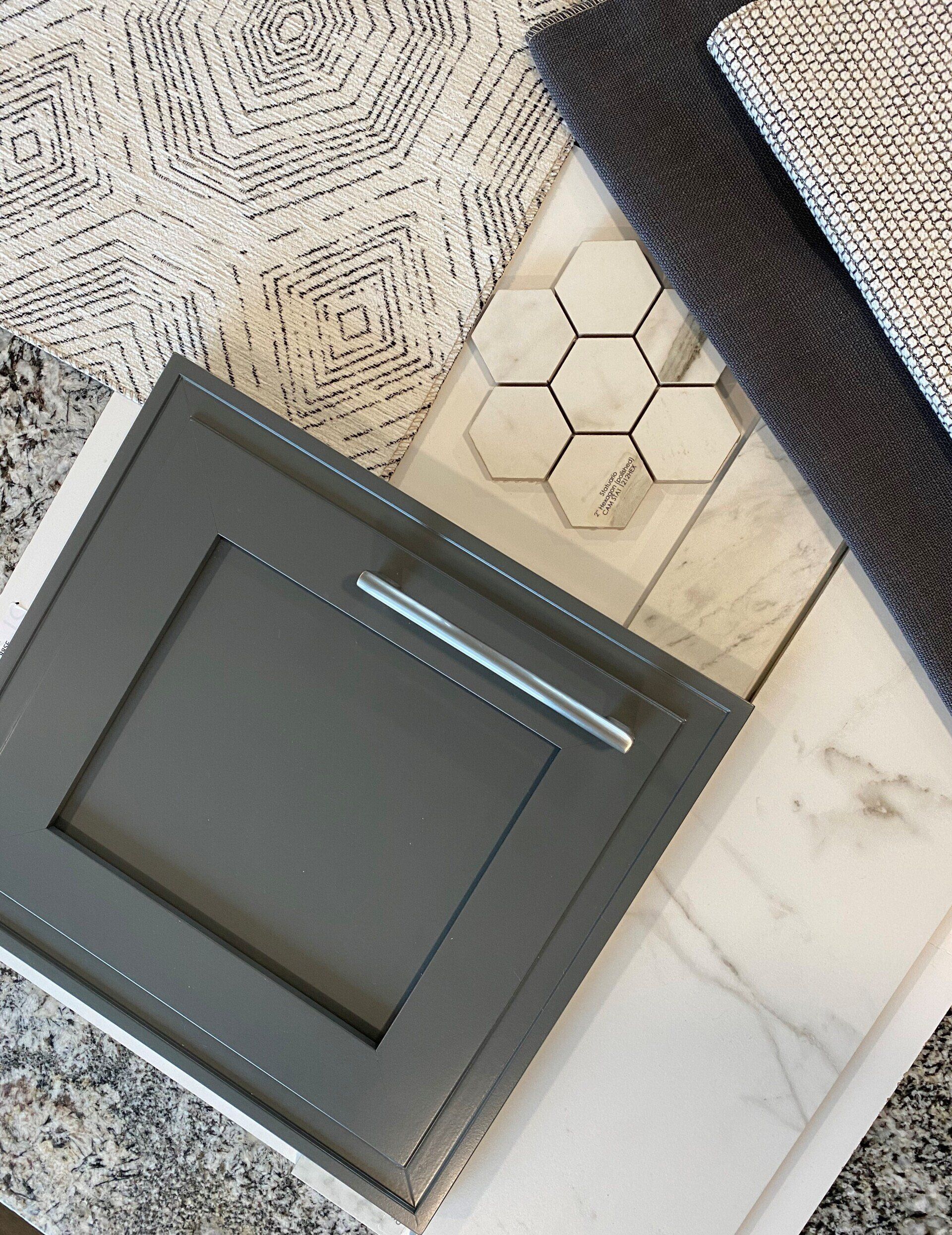 Kitchen design concept: gray cabinet, marble tile, hexagon mosaic, patterned rug, and gray fabrics.