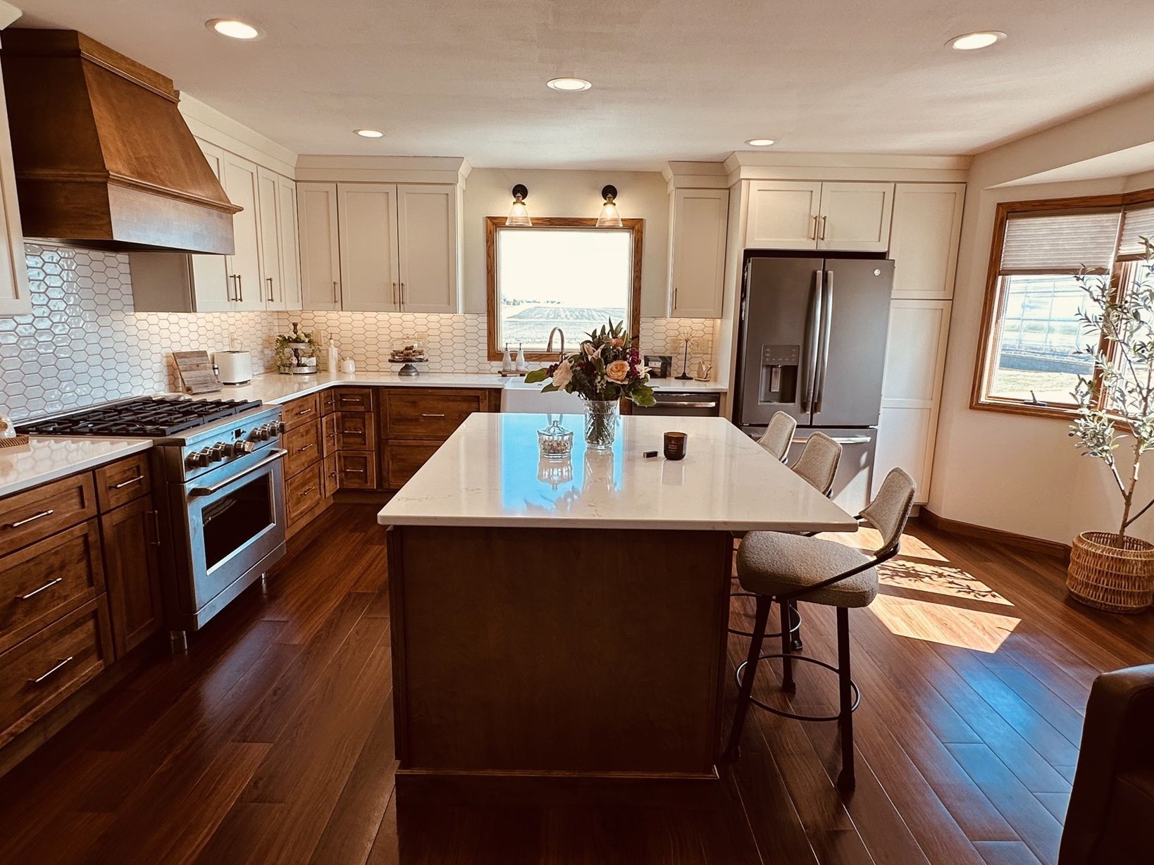 A kitchen with stainless steel appliances and wooden cabinets.