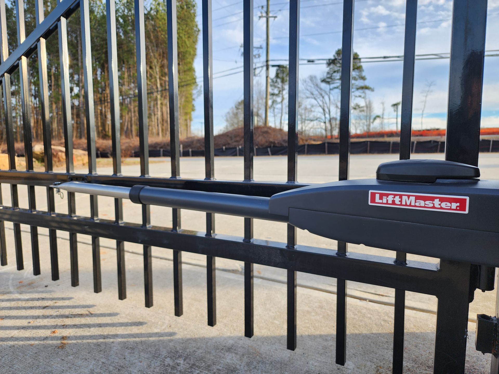 A close up of a gate with a lift master logo on it