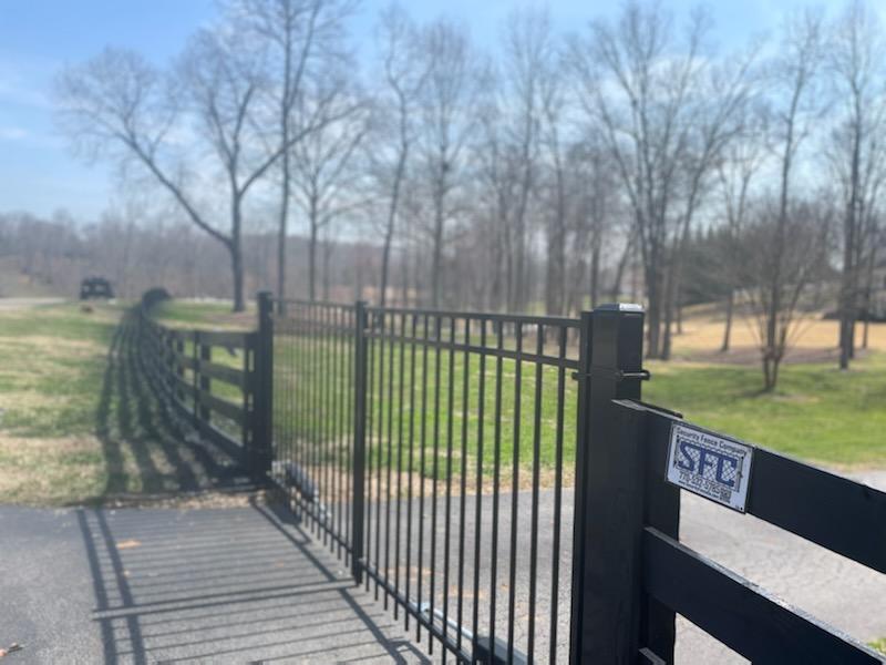 A black fence with a sign that says sfc on it