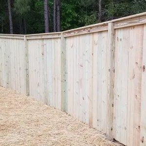 A wooden fence is sitting on top of a pile of hay.