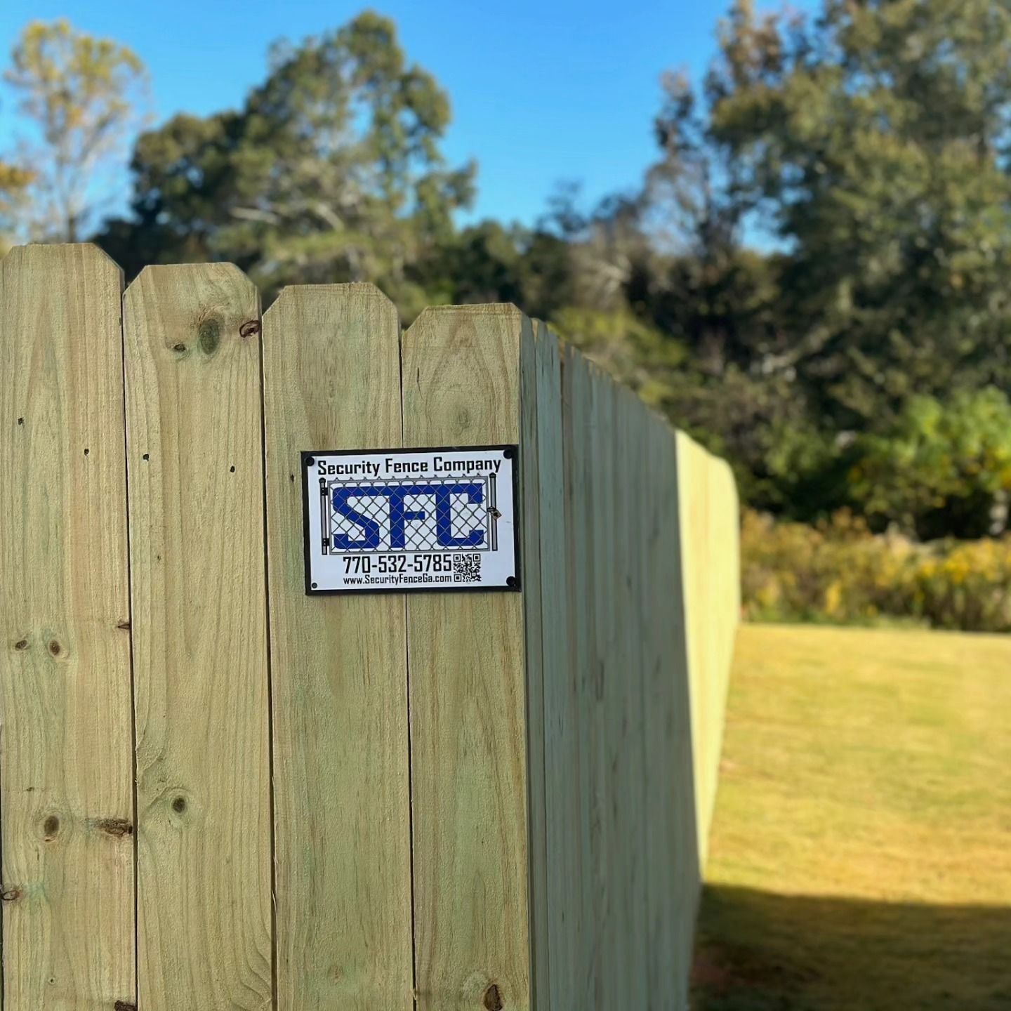 A wooden fence with a sign on it that says stl