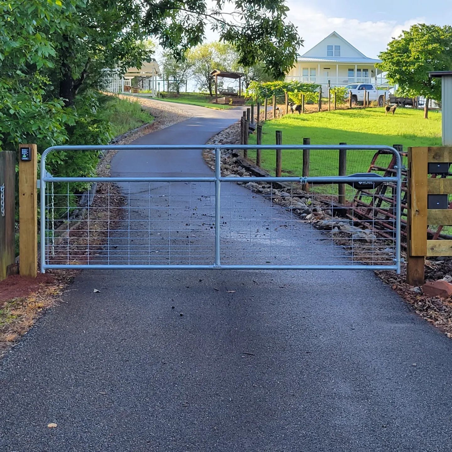 A gate on the side of a road with the number 1 on it