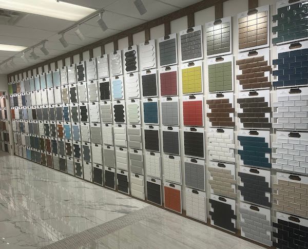 A wall filled with lots of different colored tiles