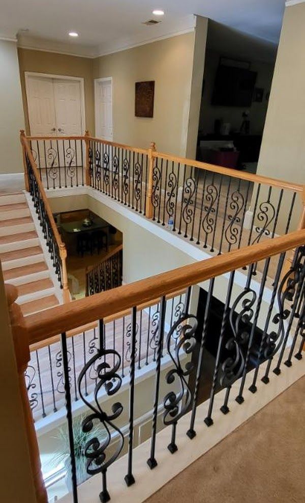 A view of a staircase from the second floor of a house