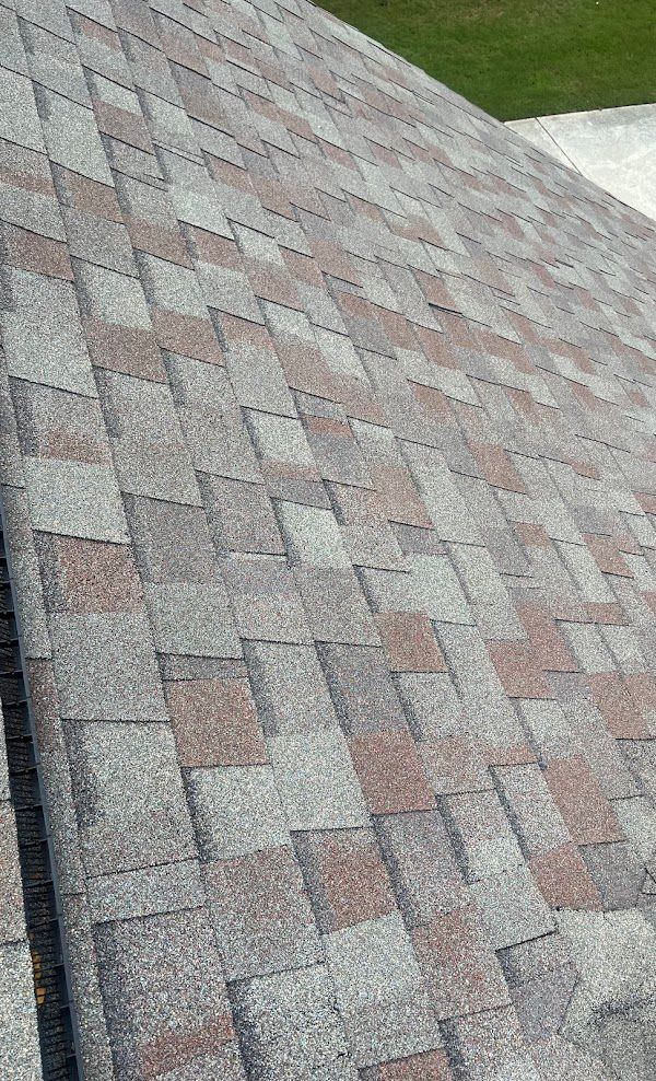 A close up of a roof with shingles on it