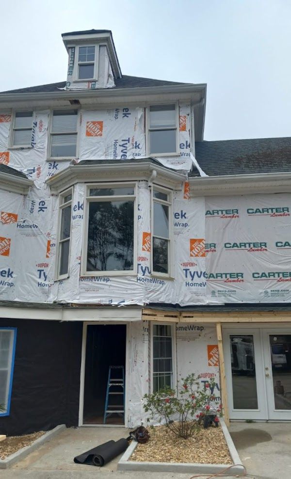 A house with a lot of windows is being built